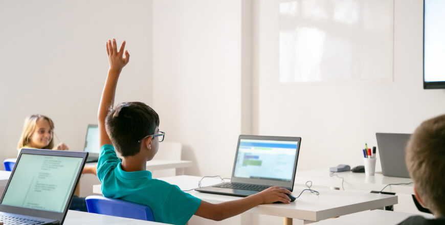 mixed-race-boy-glasses-rising-hand-answer-lesson.jpg